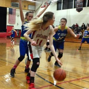 Zoe Waltz is pursued by two Mt. Abram players at Monday night’s game won by the Roadrunners. PHIL DI VECE/Wiscasset Newspaper