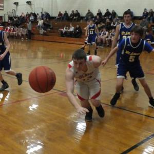 Wiscasset’s Haiden Dunning has a trio of Mt. Abram Roadrunners in pursuit during Monday night’s game. PHIL DI VECE/Wiscasset Newspaper