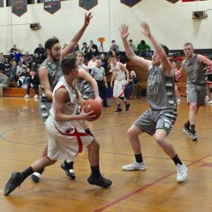 Josh Gabriele makes a break for the basket. Defending are Nate LeBlanc #33 and Cam Wood #45. PHIL DI VECE/Wiscasset Newspaper