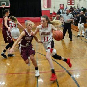 Zoe Waltz makes a break for the basket against Monmouth’s Audrey Fletcher. PHIL DI VECE/Wiscasset Newspaper