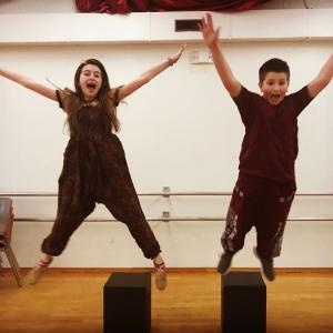 Timon (Maeve Cullina) and Pumba (Trey Tibbetts) jump for joy while preparing for the Y Arts winter musical. Emily Mirabile photo