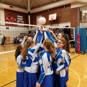 Wiscasset Christian Academy's girls volleyball team holds up its second Athletics Christian Education League state championship trophy in two years Feb. 22. Courtesy of Chad Jones