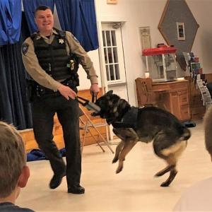 Deputy Dennsion and Duke the crime fighting German shepherd, mid-demonstration Feb. 23. Robin Ford photo