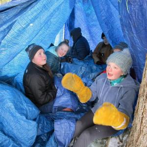 In a survival tent of their own making are, from left, Wiscasset Middle High School seventh graders Kaitlyn Talbert, Emily Gilliam and Sadie Yeaton. PHIL DI VECE/Wiscasset Newspaper