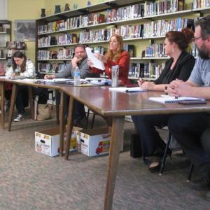 Superintendent of Schools Terry Wood hands out copies of the draft 2019-2020 school budget Tuesday night. PHIL DI VECE/Wiscasset Newspaper
