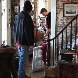 Two Lincoln Academy students volunteer cleaning house through the IDEAL program. Courtesy of Ben Borkowski