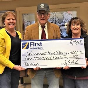 Wiscasset branch manager Monique McRae, left, and branch supervisor Ann Clifford, right, present Wiscasset Food Pantry with a $500 check from First National Bank. Courtesy photo