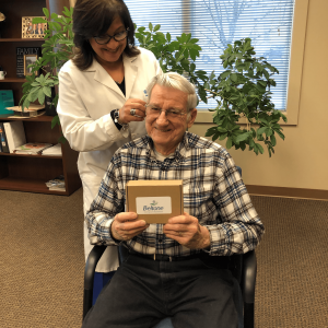 Bill James of Wiscasset gets his hearing aids March 22. Courtesy of Beltone Hearing Care Foundation