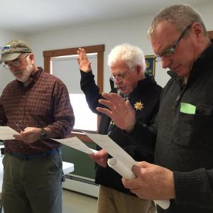 From left, newly elected Third Selectman Greg Shute and Second Selectman Doug Baston and newly reelected road commissioner Jeff Verney get sworn in after town meeting. SUSAN JOHNS/Wiscasset Newspaper