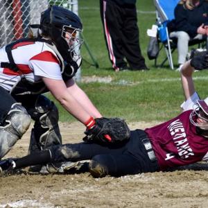 Wolverine catcher Ellie Pratt applies the tag on Monmouth’s Emily Kaplan at home plate Tuesday. PHIL DI VECE/Wiscasset Newspaper