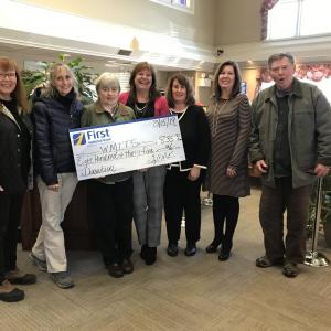 Wiscasset Museum in the Street’s representatives Peggy Konitzky, Sue Robson, Mary Ellen Barnes and Ed Kavanagh get a check from First National Bank’s Monique McRae, Ann Clifford and Sherry Smith. Courtesy photo