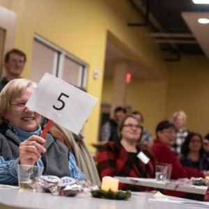 Making a bid at the Cabin Fever Reliever fundraiser. Megan Dichter photo