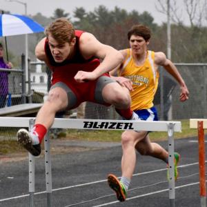 Wiscasset’s Matt Chapman won the 100-meter hurdles at Monday’s MVC track meet hosted by the Wolverines. Boothbay Region’s Quinn Ranta, also pictured placed second in the event. PHIL DI VECE/Wiscasset Newspaper