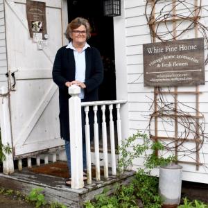 Betsy Kyle in the entrance of White Pine Home at 57 Washington St., Wiscasset. PHIL DI VECE/Wiscasset Newspaper