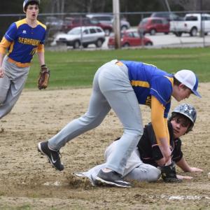 Casey Mills slides safely into third base beating the throw to Seahawk third baseman Will LaBrecque. PHIL DI VECE/Wiscasset Newspaper