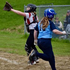 Wolverine catcher Farrah Casey catches the throw to the plate but too late to get Dirigo’s Abby Stevens in the fourth inning. PHIL DI VECE/Wiscasset Newspaper