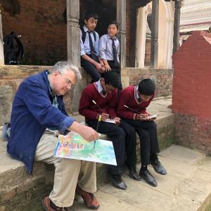 Henry Isaacs painting with students during his April journey to Nepal. Courtesy of Gleason Fine Art