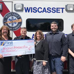 First National Bank’s branch manager Monique McRae and branch supervisor Ann Clifford present a check to Wiscasset Ambulance Service in honor of National EMS Week. Courtesy photo
