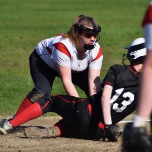 Wolverine third baseman Ellie Pratt applies the tag to a Lisbon runner. PHIL DI VECE/Wiscasset Newspaper