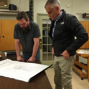 Wiscasset Planning Board member Jason Putnam, left, and Chris Nadeau of Nobis Group look at the final plans for a Dollar General May 13. SUSAN JOHNS/Wiscasset Newspaper