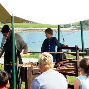 Jeff Miller, blacksmith, working at his temporary forge, demonstrates blacksmithing to students at Colonial Pemaquid State Historic Site. The public is invited to observe him at work at the Chapman-Hall House in Damariscotta on June 16. Courtesy photo