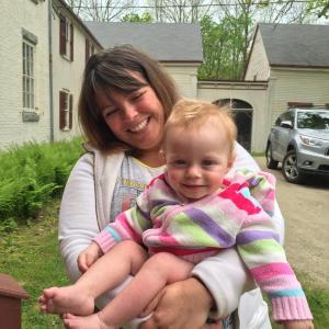 Bath's Monica Finley holds her baby Wilder York, 14 months, at the June 1 open house at Castle Tucker. SUSAN JOHNS/Wiscasset Newspaper