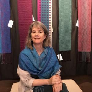 Amy Smith with a selection of her woven scarves. Courtesy of Mary Hall