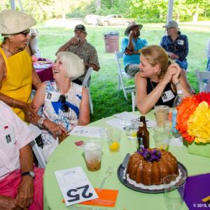 Guests at Lincoln County Historical Association’s annual Kermess celebrate their winning bid for a cake. Photo by Bob Bond