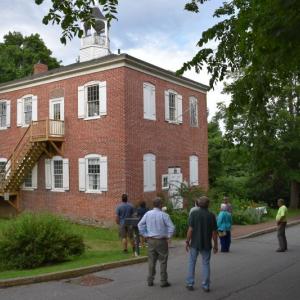 The select board began its meeting Tuesday by touring the town-owned Wiscasset Academy building, home to the Maine Art Gallery. PHIL DI VECE/Wiscasset Newspaper