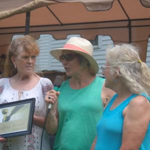 Nancy Cote, left, receives the “Spirit of America” award from State Sen. Eloise Vitelli, center, and State Rep. Allison Hepler. ART MAYERS/Wiscasset Newspaper