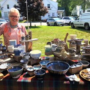 Ann Hedgcock and her pottery on the Boothbay Common on a recent afternoon. JENNY BENNETT/Boothbay Register