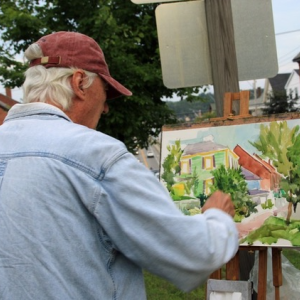 Artists are invited to paint in the town of Wiscasset during the last three days of August. Tony van Hasselt captures Main Street in an earlier event. Courtesy of Christine Hopf-Lovette
