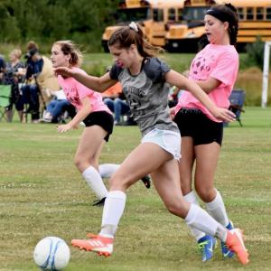 Cara Viele carries the ball past a Madison defender at Saturday’s “Kickoff Classic.” PHIL DI VECE/Wiscasset Newspaper