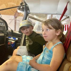 Visiting Wiscasset Municipal Airport on Labor Day, Sept. 2, Alna siblings Eben Robinson, 7, and Savannah Robinson, 4, check out the inside of a Cessna 185 float plane. SUSAN JOHNS/Wiscasset Newspaper
