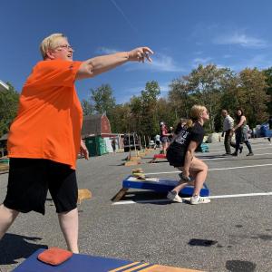 The First National Bank’s Jean Moffatt throws a practice bag at at a cornhole tournament at Ames True Value Supply Sept. 22 to benefit the masons’ Lincoln Lodge in Wiscasset. SUSAN JOHNS/Wiscasset Newspaper
