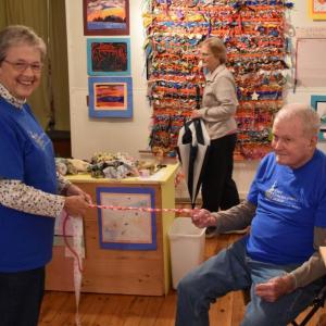 Nancy and Wally Roby braid a string for the community tapestry. PHIL DI VECE/Wiscasset Newspaper