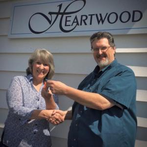 Heartwood Director Griff Braley hands over studio keys to Beth Preston, now offering vocal lessons as part of Heartwood Theater's programming. Courtesy of Joy Braley