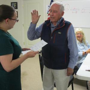 Town Clerk Chelsea Lane swears in John Chapman to moderate Monday’s special town meeting. PHIL DI VECE/Wiscasset Newspaper