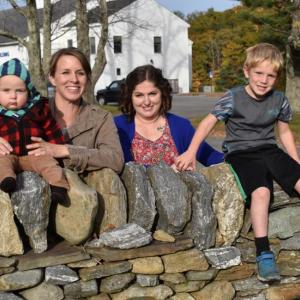 Petition organizers Danielle Friend, holding her 11-month-old son Michael, and Sherri Harvey with her son, Josh, 5. In the background, the Woolwich municipal building. PHIL DI VECE/Wiscasset Newspaper