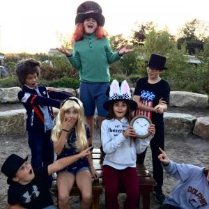 The Mad Hatter's Tea Party. Pictured from left are, front: Ford Harris (Party Guest/Dodo Bird), Anna Tomasello (Alice), Laura Tomasello (White Rabbit), Rebecca Tomasello (Matilda/Party Guest); back: Tyler Thompson (March Hare), Spencer Pottle (Mad Hatter) and Caleb Innes (Doorknow/Party Guest). Courtesy of Emily Mirabile