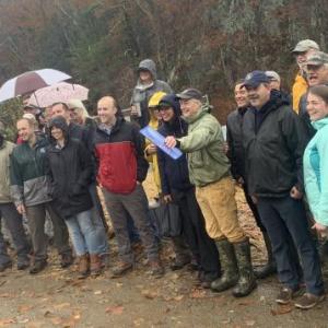 Alna residents, Atlantic Salmon Federation staff and others celebrate at Alna’s Head Tide Dam in the rain Oct. 31. SUSAN JOHNS/Wiscasset Newspaper