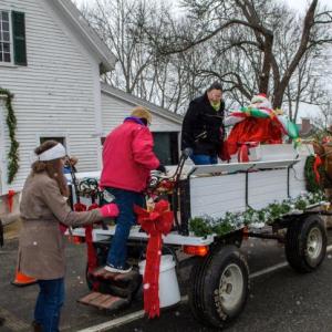 Climb aboard the Woodfield Farm horse-drawn wagon with shuttle service in the Village Dec. 7. file photo