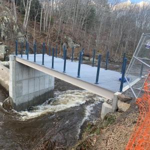 A river rushes through it Dec. 15. Above is the partly done railing ASF now hopes to finish this week. SUSAN JOHNS/Wiscasset Newspaper
