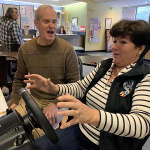 Boothbay Harbor’s Rick Tarr and WCC Aquatics Director Lori LaPointe react to LaPointe’s driving on a simulator at Winterfest Feb. 1. SUSAN JOHNS/Wiscasset Newspaper