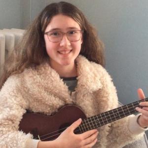 Julia Truesdell poses with her ukulele. Courtesy of Lisa Truesdell