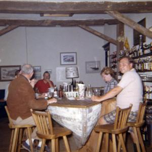 Opening day at The Thistle Inn, 1964. Husband and wife owners Leonie Greenwood-Adams (behind the bar) and T’Donald Booth Moore. Photo by Nadeen Reinecke