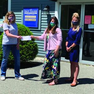 Jess Breithaupt, left, LCFI Project Coordinator, receives check from Office Administrator and CFG Outreach Coordinator, Kristy Battles and Hannah Kutschinski, Administrative Assistant at Newcastle Realty. Kim Traina photo