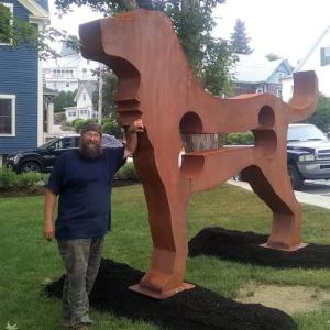 Artist Dale Rogers and his work, “The Dog” at McKown Square. Bill Royall photo