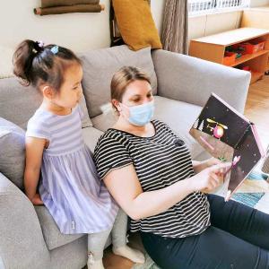 Carolyn Remley reads to a student. Courtesy photo