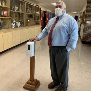 WMHS Principal Charles Lomonte with a hand sanitizer in the lobby. SUSAN JOHNS/Wiscasset Newspaper